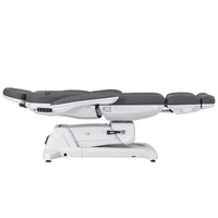 Fotel kosmetyczny WEELKO® SIMUS GYN obrotowy 110° z podpórkami ginekologicznymi i pełno ruchomym zagłówkiem