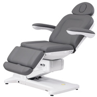 Fotel kosmetyczny WEELKO® SIMUS obrotowy 110° z podpórkami ginekologicznymi i pełno ruchomym zagłówkiem i sterowaniem nożnym